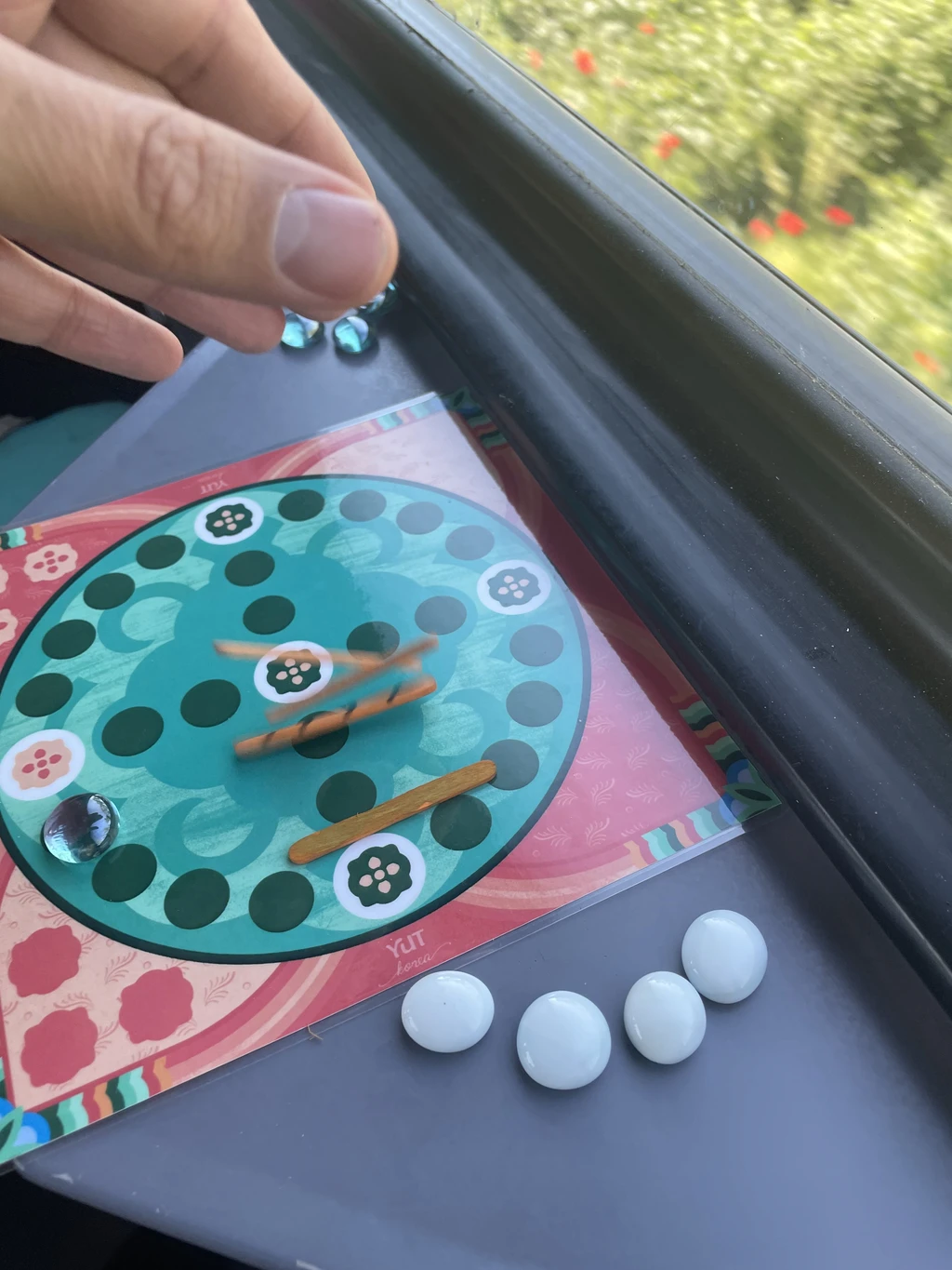 Playing Yut on the Train